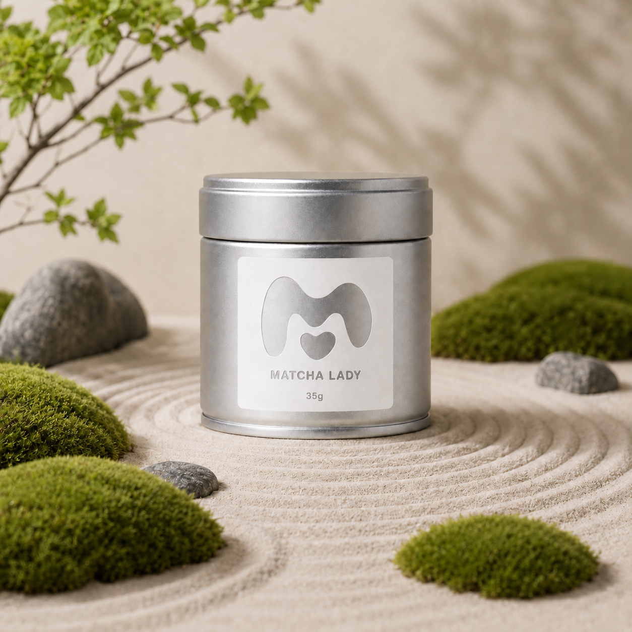35g Matcha Lady tin in a Japanese sand garden with moss and stones